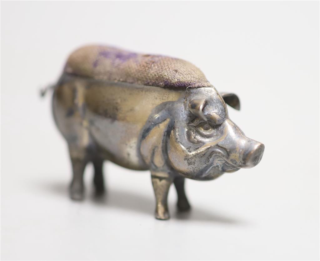 An early 20th century novelty silver pig pin cushion, Adie & Lovekin, circa 1905(marks very rubbed), length 54mm.